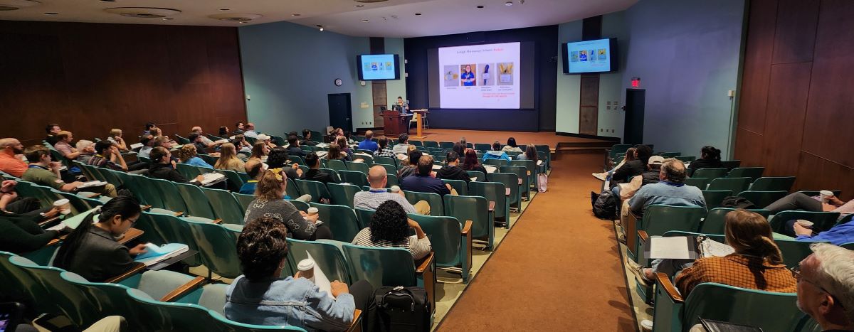 an auditorium showing participants at the 2025 LMS