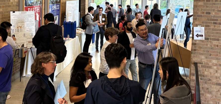 Attendees at the I-FMD materials symposium poster session