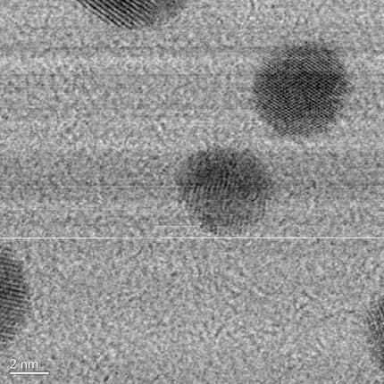 Scanning transmission electron microscope image showing particles with a diameter slightly larger than 2 nanometers. The particles are observed as dark spots against a light background.