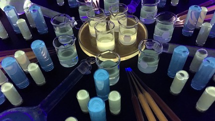 image of various quantum dots in beakers